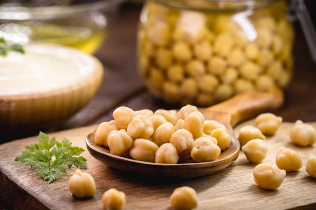 Chickpea seeds cooked in wooden spoon culinary ingredient for seasonings and vegan meals