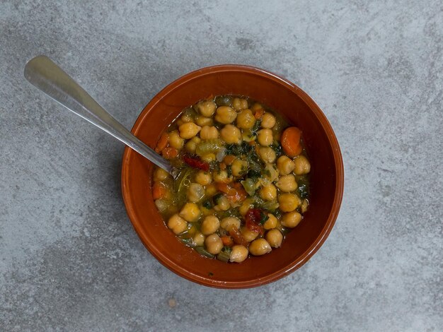 Chickpea soup cherry tomatoes and rocket vegetarian food