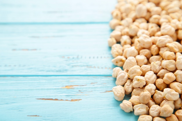 Chickpeas grains on blue wooden