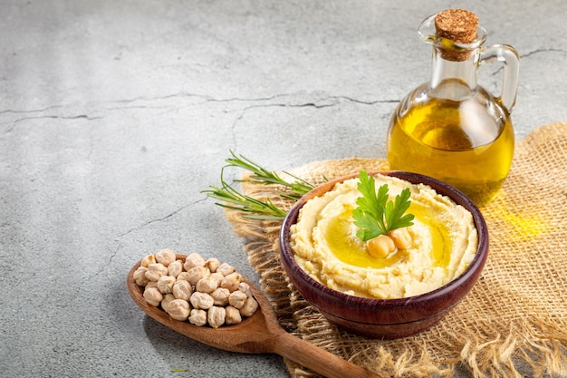 Chickpeas hummus with olive oil in the bowl