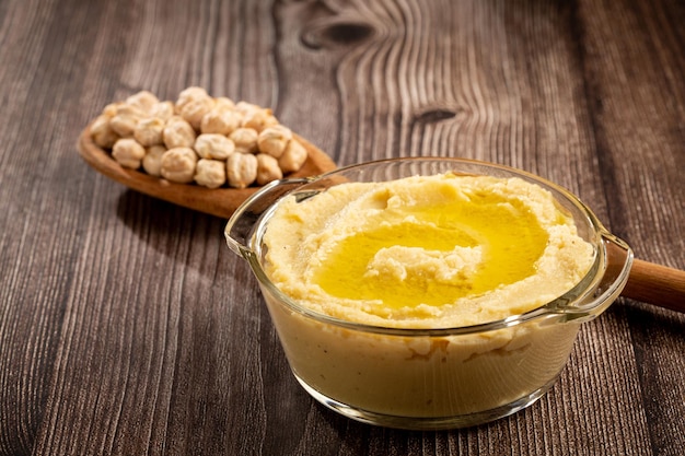 Chickpeas hummus with olive oil in the bowl