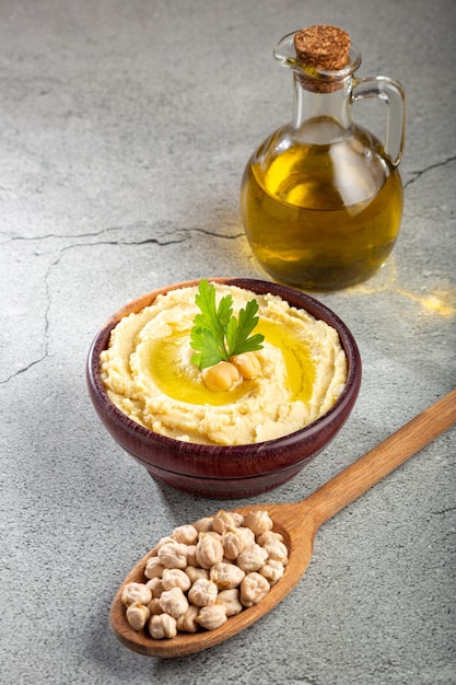 Chickpeas hummus with olive oil in the bowl