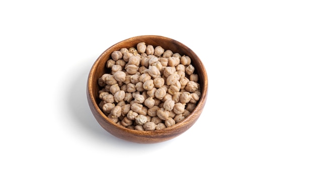 Chickpeas in wooden bowl isolated on a white background. High quality photo