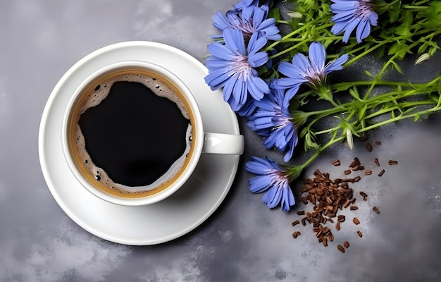 Photo chicory flowers and herbs and coffee cup on grey snowy backgroun