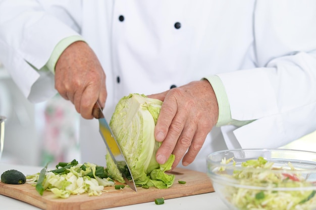 Chiefs hands cutting cabbage