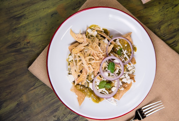 chilaquiles in a white plate - mexican food