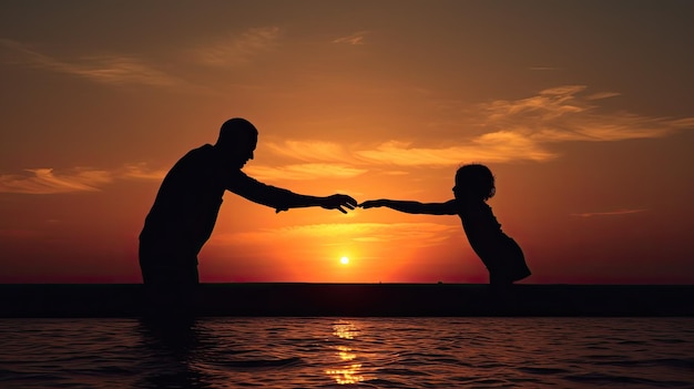 Child and adult hands touch fingers by the sea at sunset