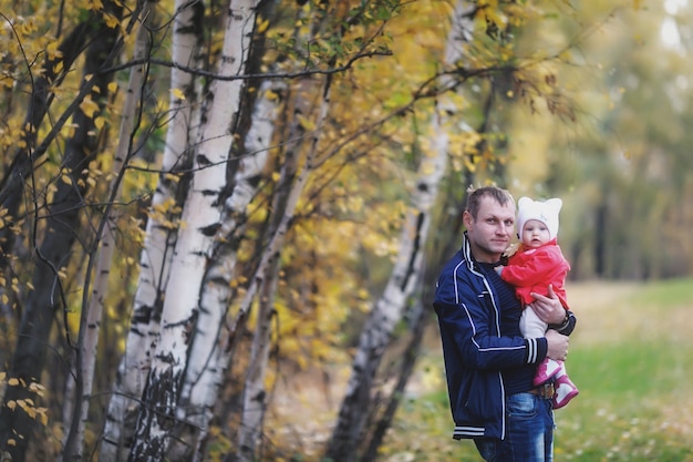 Child in arms of man's father