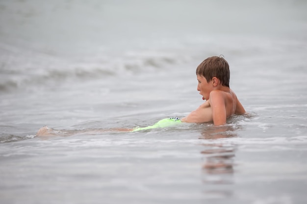 The child bathes sunbathes and rests Summer holidays