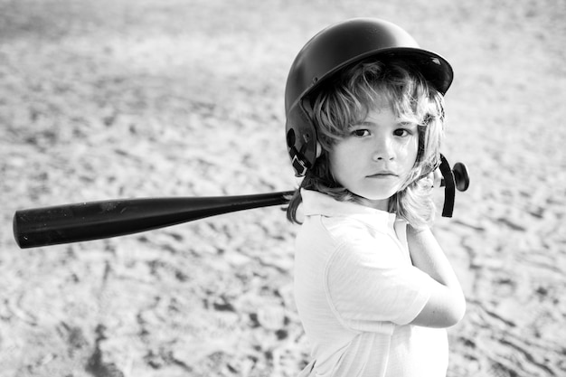 Child batter about to hit a pitch during a baseball game. Kid baseball ready to bat.