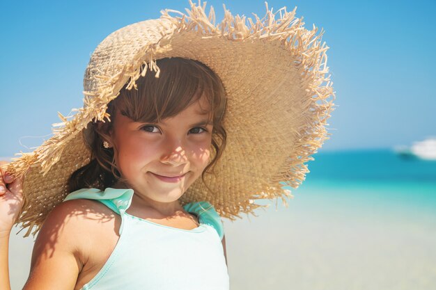 A child on the beach near the sea. 