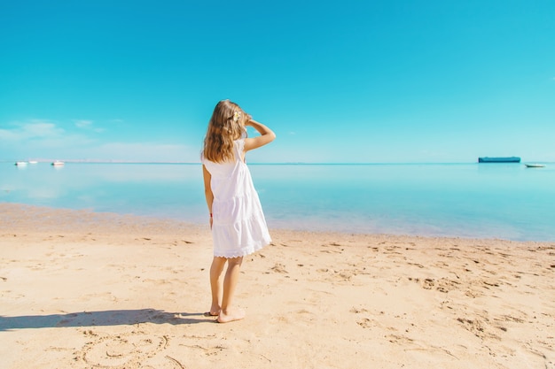 Child on the beach. Sea shore. Selective focus.