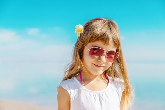 Child on the beach. Sea shore. Selective focus.