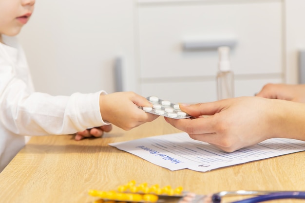 Child being checked by a doctor. Selective focus