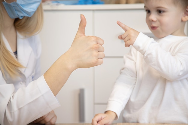 Child being checked by a doctor. Selective focus