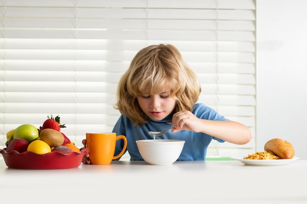 Child boy eating organic healthy food healthy vegetables with vitamins proper kids nutrition concept