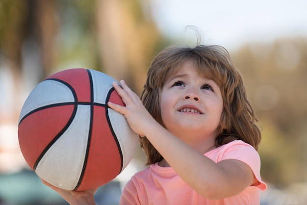 Child boy face preparing for basketball shooting best sport for kids