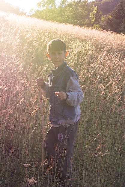 Child boy hiking in scenic nature