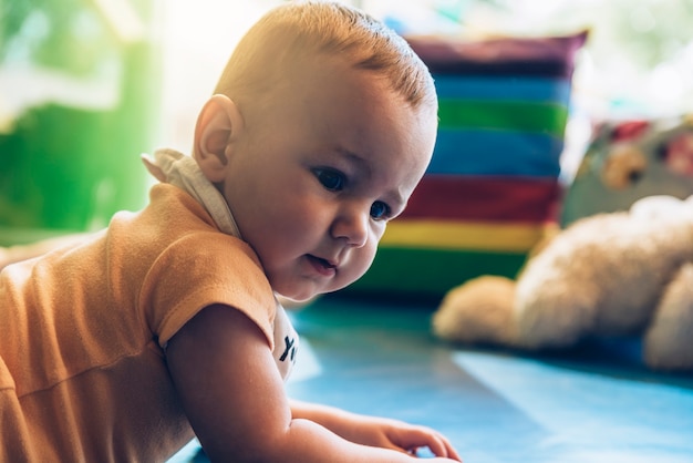 Child boy and mother playing with educational toy.