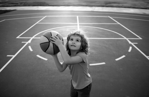 Child boy preparing for basketball shooting best sport for kids