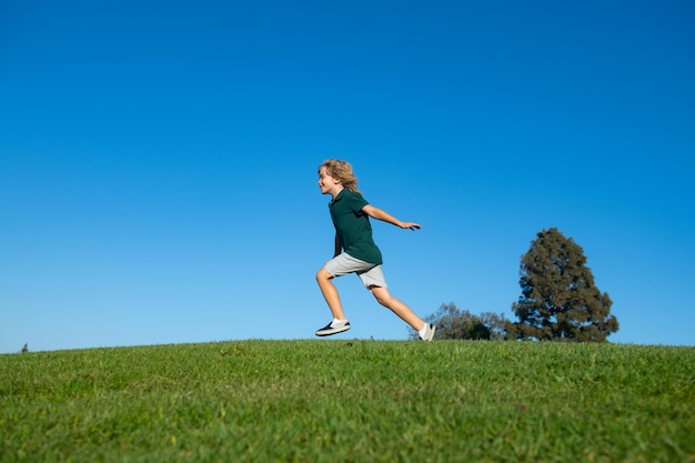 Child boy running outdoors in sunny summer day Active healthy outdoor sport Fun activity