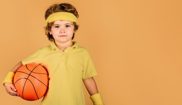 Child boy in sportswear with ball sport for children basketball player healthy lifestyle