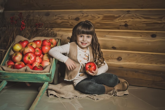 The child and a cart with apples 1451