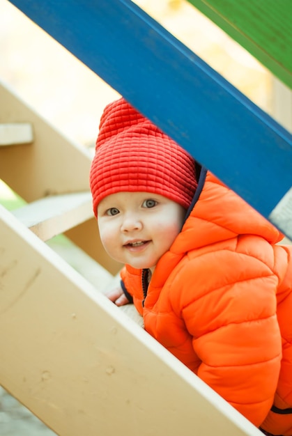 The child climbs the steps on the playground