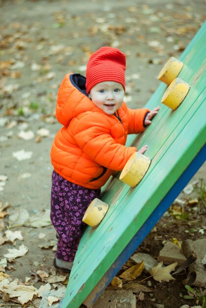 The child climbs the steps on the playground