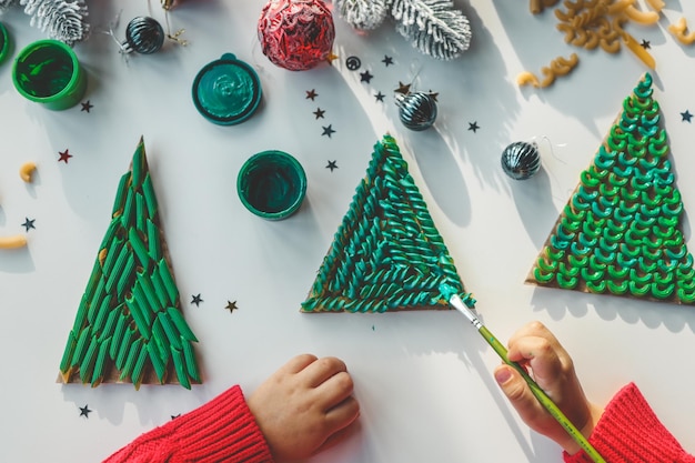 Child coloring pasta creativity christmas activity idea