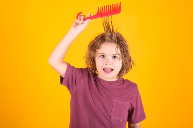 Child combing hair after shower little kid combing hair isolated studio background