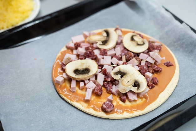 Child cook homemade pizza, little girl makes pizza at home