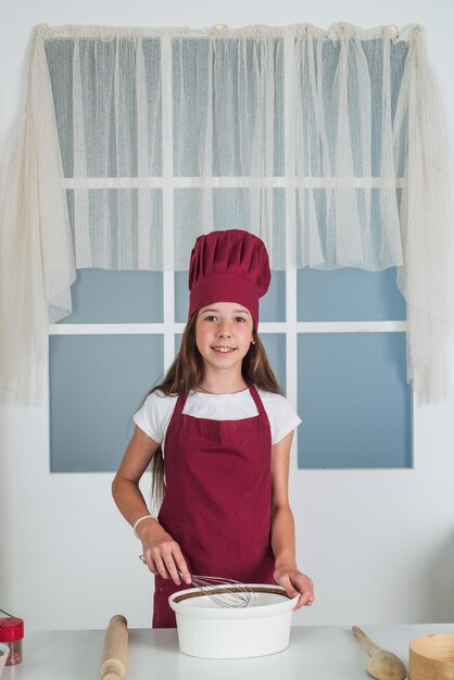 Child cooking food in kitchen childhood