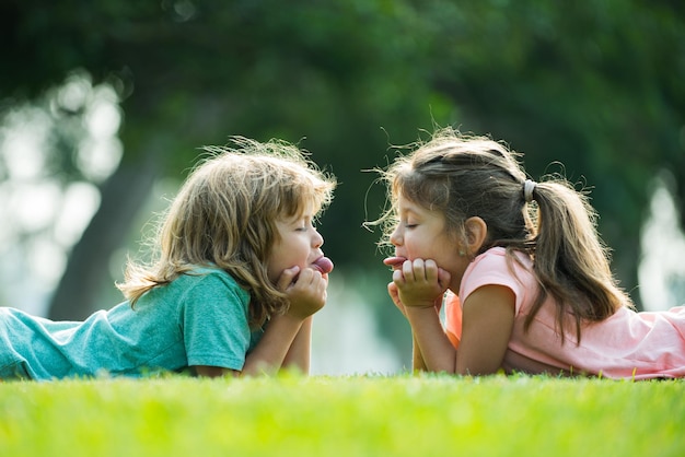 Child couple in love children or kids relationships little boy girl outdoors in park