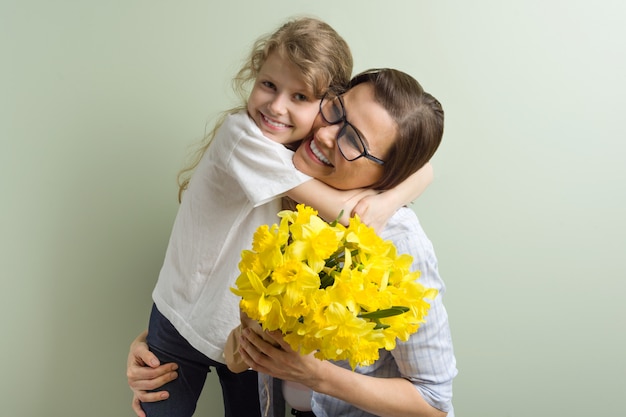 Child daughter congratulates mother