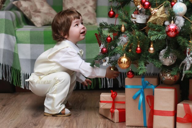 Child decorate the Christmas tree toy