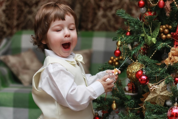 Child decorate the Christmas tree toy