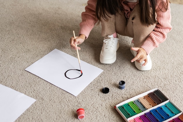 Photo child doing household activities indoors