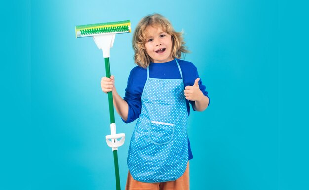 Child doing housework child use duster and gloves for cleaning\
funny child mopping house cleaning accessory cleaning supplies\
housekeeping and home cleaning