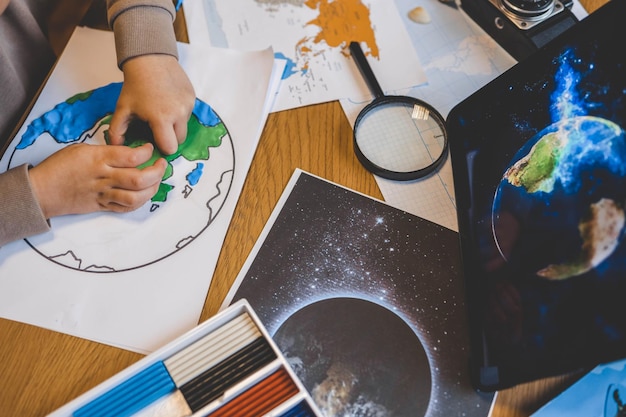 Child doing plasticine save the earth concept