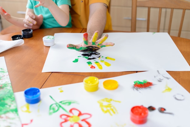 child drawing with paint