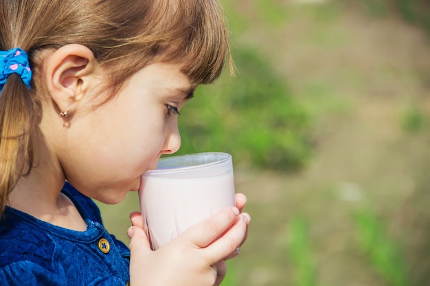 The child drinks milk. Selective focus. Kids.