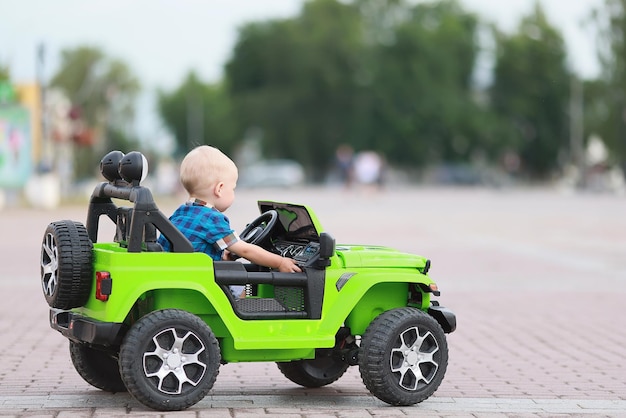 child driver electric car attraction SUV small