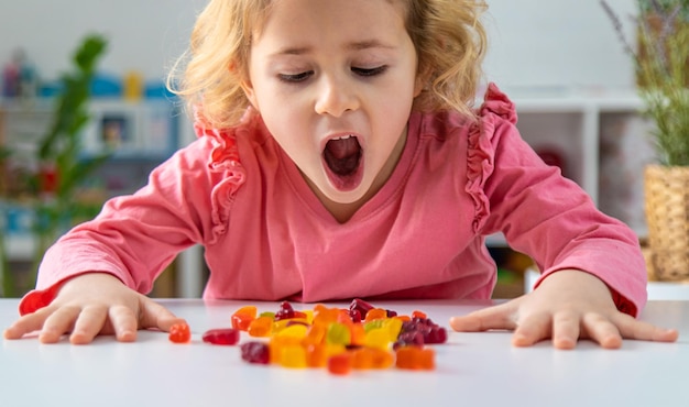 child eating jelly candies at home selective focus