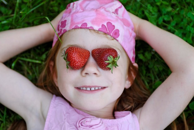 Child eating strawberries