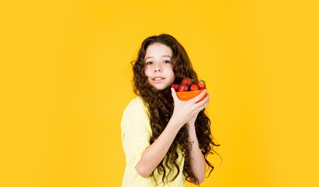 Child eating strawberry Healthy breakfast Vitamin concept Summer berries Dessert sweet food Buy red berry My summer pleasure Girl eating homegrown strawberry Healthy food Health care