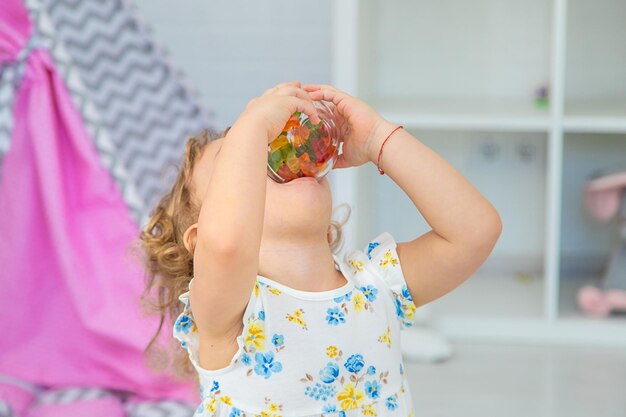 The child eats jelly candies Selective focus