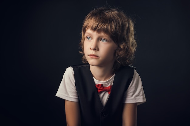 Child emotionally posing on camera in the Studio on a white background