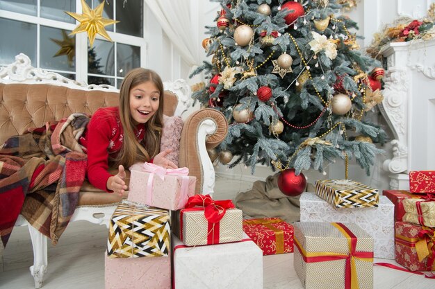 Child enjoy the holiday By golly be jolly Happy new year Winter xmas online shopping Family holiday Christmas tree and presents The morning before Xmas Little girl