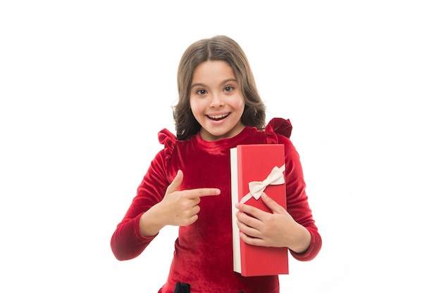 Photo child excited about unpacking her gift small cute girl received holiday gift best toys and christmas gifts feeling so excited kid little girl in elegant dress hold gift box white background